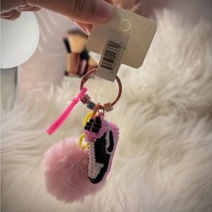 Nike Pink and Black Keychain with Pom Pom